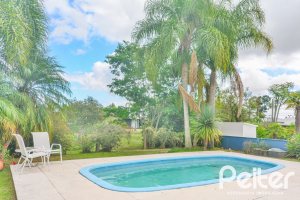 Casa em Condomínio à venda com 358m², 3 dormitórios, 3 suítes, 4 vagas, no bairro Terra Ville em PORTO ALEGRE