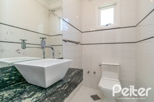 Casa em Condomínio à venda com 217m², 3 dormitórios, 1 suíte, 2 vagas, no bairro Terra Ville em Porto Alegre