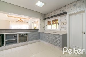 Casa em Condomínio à venda com 217m², 3 dormitórios, 1 suíte, 2 vagas, no bairro Terra Ville em Porto Alegre