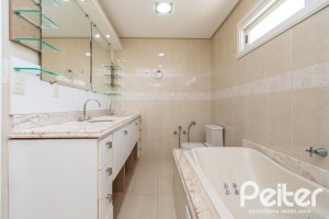 Casa em Condomínio à venda com 217m², 3 dormitórios, 1 suíte, 2 vagas, no bairro Terra Ville em Porto Alegre