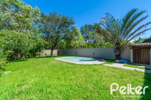 Casa em Condomínio à venda com 217m², 3 dormitórios, 1 suíte, 2 vagas, no bairro Terra Ville em Porto Alegre