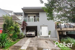 Casa em Condomínio à venda com 132m², 3 dormitórios, 1 suíte, 2 vagas, no bairro Vila Nova em PORTO ALEGRE