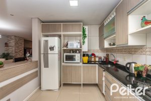 Casa em Condomínio à venda com 132m², 3 dormitórios, 1 suíte, 2 vagas, no bairro Vila Nova em PORTO ALEGRE