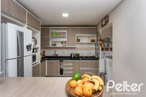 Casa em Condomínio à venda com 132m², 3 dormitórios, 1 suíte, 2 vagas, no bairro Vila Nova em PORTO ALEGRE