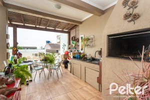 Casa em Condomínio à venda com 132m², 3 dormitórios, 1 suíte, 2 vagas, no bairro Vila Nova em PORTO ALEGRE