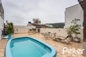 Casa em Condomínio à venda com 132m², 3 dormitórios, 1 suíte, 2 vagas, no bairro Vila Nova em PORTO ALEGRE