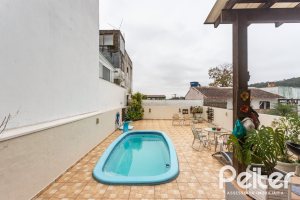 Casa em Condomínio à venda com 132m², 3 dormitórios, 1 suíte, 2 vagas, no bairro Vila Nova em PORTO ALEGRE