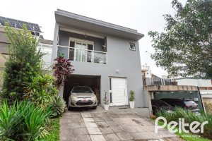 Casa em Condomínio à venda com 132m², 3 dormitórios, 1 suíte, 2 vagas, no bairro Vila Nova em PORTO ALEGRE