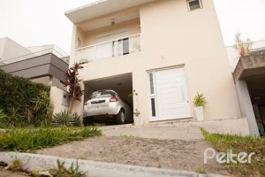 Casa em Condomínio à venda com 132m², 3 dormitórios, 1 suíte, 2 vagas, no bairro Vila Nova em PORTO ALEGRE