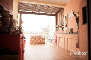 Casa em Condomínio à venda com 132m², 3 dormitórios, 1 suíte, 2 vagas, no bairro Vila Nova em PORTO ALEGRE