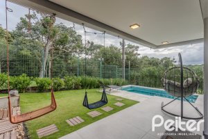 Casa em Condomínio à venda com 359m², 4 dormitórios, 4 suítes, 4 vagas, no bairro Alphaville em PORTO ALEGRE