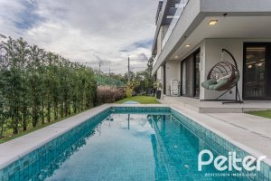 Casa em Condomínio à venda com 359m², 4 dormitórios, 4 suítes, 4 vagas, no bairro Alphaville em PORTO ALEGRE