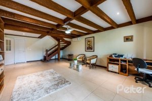 Casa em Condomínio à venda com 449m², 3 dormitórios, 3 suítes, 6 vagas, no bairro Terra Ville em PORTO ALEGRE