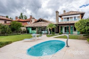 Casa em Condomínio à venda com 449m², 3 dormitórios, 3 suítes, 6 vagas, no bairro Terra Ville em PORTO ALEGRE