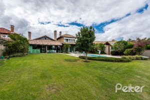 Casa em Condomínio à venda com 449m², 3 dormitórios, 3 suítes, 6 vagas, no bairro Terra Ville em PORTO ALEGRE