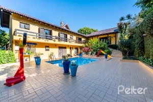 Casa em Condomínio à venda com 400m², 5 dormitórios, 2 suítes, 3 vagas, no bairro Cavalhada em PORTO ALEGRE