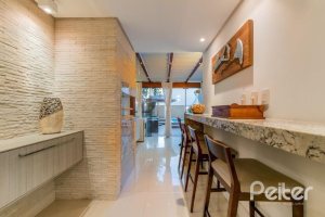 Casa em Condomínio à venda com 296m², 3 dormitórios, 1 suíte, 2 vagas, no bairro Vila Assunção em Porto Alegre