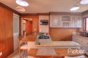 Casa à venda com 323m², 5 dormitórios, 3 suítes, 4 vagas, no bairro Tristeza em Porto Alegre