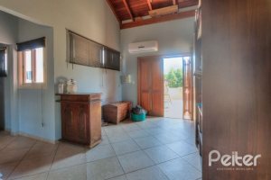 Casa à venda com 323m², 5 dormitórios, 3 suítes, 4 vagas, no bairro Tristeza em Porto Alegre