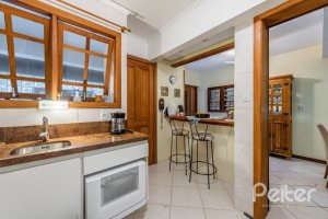 Casa em Condomínio à venda com 181m², 3 dormitórios, 1 suíte, 3 vagas, no bairro Tristeza em PORTO ALEGRE