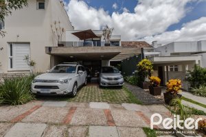 Casa em Condomínio à venda com 185m², 3 dormitórios, 1 suíte, 2 vagas, no bairro Vila Nova em PORTO ALEGRE