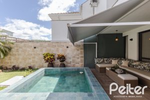 Casa em Condomínio à venda com 185m², 3 dormitórios, 1 suíte, 2 vagas, no bairro Vila Nova em PORTO ALEGRE