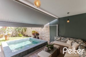 Casa em Condomínio à venda com 185m², 3 dormitórios, 1 suíte, 2 vagas, no bairro Vila Nova em PORTO ALEGRE