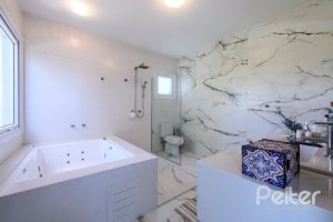 Casa em Condomínio à venda com 339m², 4 dormitórios, 4 suítes, 4 vagas, no bairro Terra Ville em PORTO ALEGRE