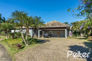 Casa em Condomínio à venda com 533m², 4 dormitórios, 2 suítes, 6 vagas, no bairro Terra Ville em PORTO ALEGRE