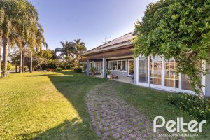 Casa em Condomínio à venda com 533m², 4 dormitórios, 2 suítes, 6 vagas, no bairro Terra Ville em PORTO ALEGRE