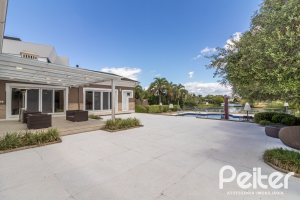 Casa em Condomínio à venda com 445m², 4 dormitórios, 4 suítes, 4 vagas, no bairro Terra Ville em Porto Alegre