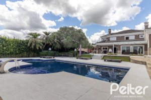 Casa em Condomínio à venda com 445m², 4 dormitórios, 4 suítes, 4 vagas, no bairro Terra Ville em Porto Alegre