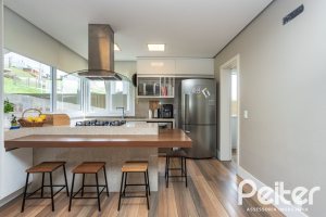 Casa em Condomínio à venda com 337m², 4 dormitórios, 1 suíte, 4 vagas, no bairro Alphaville em PORTO ALEGRE