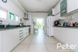 Casa em Condomínio à venda com 420m², 4 dormitórios, 4 suítes, 6 vagas, no bairro Terra Ville em PORTO ALEGRE