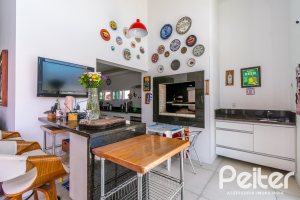 Casa em Condomínio à venda com 420m², 4 dormitórios, 4 suítes, 6 vagas, no bairro Terra Ville em PORTO ALEGRE