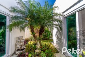 Casa em Condomínio à venda com 420m², 4 dormitórios, 4 suítes, 6 vagas, no bairro Terra Ville em PORTO ALEGRE