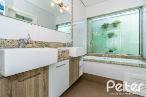 Casa em Condomínio à venda com 420m², 4 dormitórios, 4 suítes, 6 vagas, no bairro Terra Ville em PORTO ALEGRE