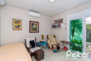 Casa em Condomínio à venda com 420m², 4 dormitórios, 4 suítes, 6 vagas, no bairro Terra Ville em PORTO ALEGRE