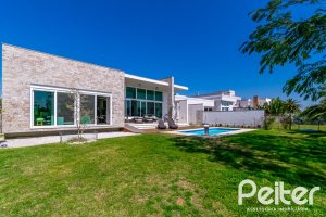 Casa em Condomínio à venda com 420m², 4 dormitórios, 4 suítes, 6 vagas, no bairro Terra Ville em PORTO ALEGRE