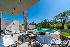 Casa em Condomínio à venda com 420m², 4 dormitórios, 4 suítes, 6 vagas, no bairro Terra Ville em PORTO ALEGRE