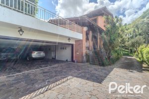 Casa em Condomínio à venda com 395m², 4 dormitórios, 4 suítes, 4 vagas, no bairro Cavalhada em PORTO ALEGRE