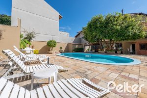 Casa em Condomínio à venda com 145m², 3 dormitórios, 1 suíte, 2 vagas, no bairro Tristeza em Porto Alegre