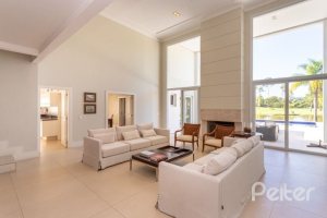 Casa em Condomínio à venda com 550m², 3 dormitórios, 3 suítes, 4 vagas, no bairro Terra Ville em PORTO ALEGRE