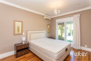 Casa em Condomínio à venda com 550m², 3 dormitórios, 3 suítes, 4 vagas, no bairro Terra Ville em PORTO ALEGRE