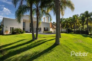 Casa em Condomínio à venda com 550m², 3 dormitórios, 3 suítes, 4 vagas, no bairro Terra Ville em PORTO ALEGRE