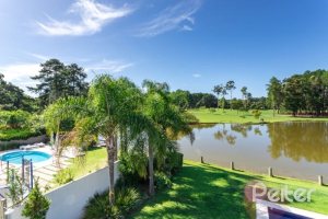 Casa em Condomínio à venda com 550m², 3 dormitórios, 3 suítes, 4 vagas, no bairro Terra Ville em PORTO ALEGRE