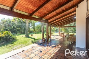 Casa em Condomínio à venda com 600m², 4 dormitórios, 4 suítes, 6 vagas, no bairro Cavalhada em PORTO ALEGRE