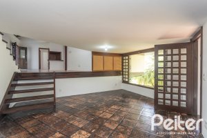 Casa em Condomínio à venda com 600m², 4 dormitórios, 4 suítes, 6 vagas, no bairro Cavalhada em PORTO ALEGRE