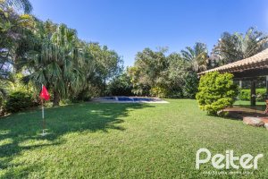 Casa em Condomínio à venda com 600m², 4 dormitórios, 4 suítes, 6 vagas, no bairro Cavalhada em PORTO ALEGRE