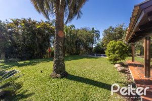 Casa em Condomínio à venda com 600m², 4 dormitórios, 4 suítes, 6 vagas, no bairro Cavalhada em PORTO ALEGRE